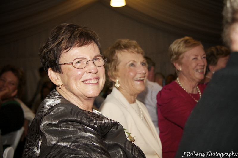Guests laughing at speeches - wedding photography sydney